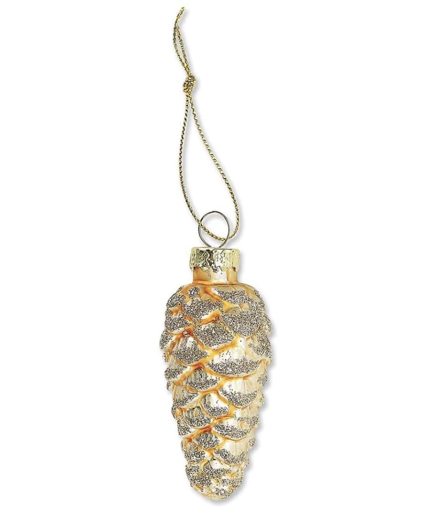 A gold and silver pinecone-shaped Christmas ornament with a shiny surface, perfect for adding a touch of elegance to your Christmas tree, is suspended by a thin gold string. This exquisite decoration seamlessly blends brown and gold hues to create a captivating holiday charm.